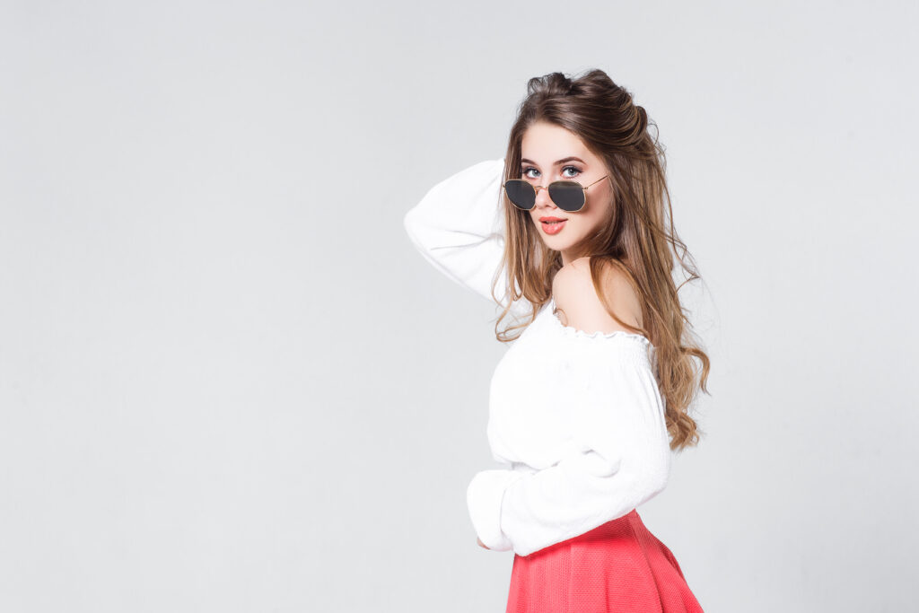 Bright positive fashion studio portrait of pretty young girl with nude lips, bright make up,  stylish trendy outfit: pink  skirt, smart casual!